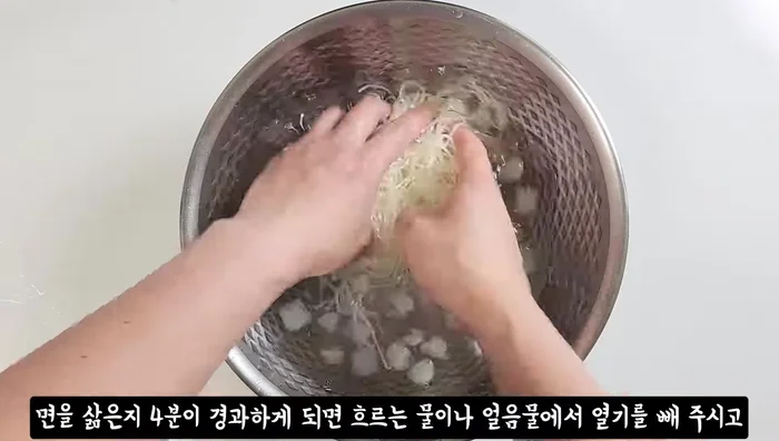 Rinse noodles under cold running water or ice water, rubbing them to remove starch.