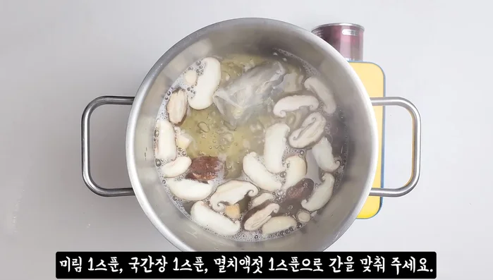 Season with mirin, soy sauce, and anchovy sauce. Simmer for 2 more minutes.