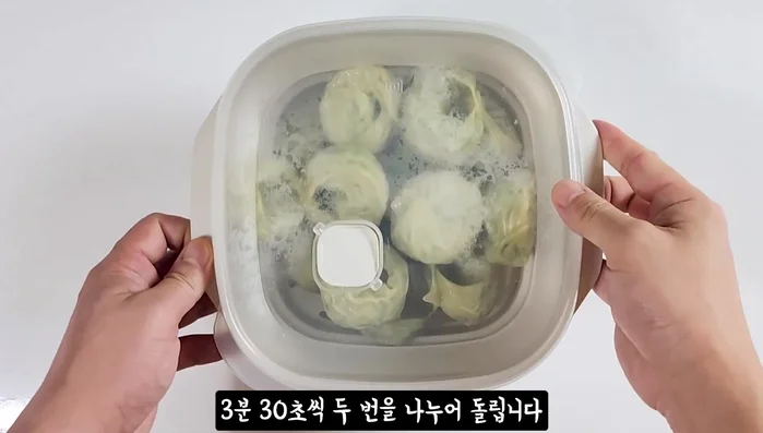 Microwave the frozen dumplings twice for 3 minutes and 30 seconds each.
