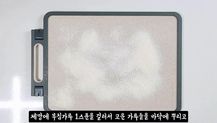 Sprinkle flour on both sides of each flattened circle.