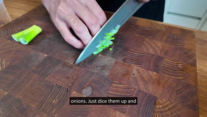 Add green onions: Finely chop green onions and mix them in.