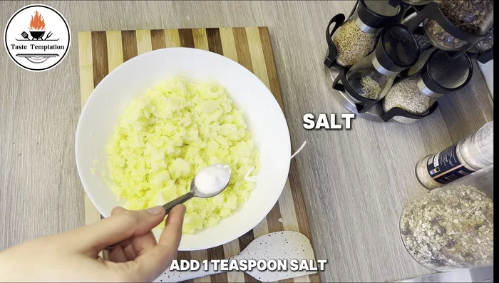 Add salt, pepper, and cornstarch to mashed potatoes; mix to form a dough.