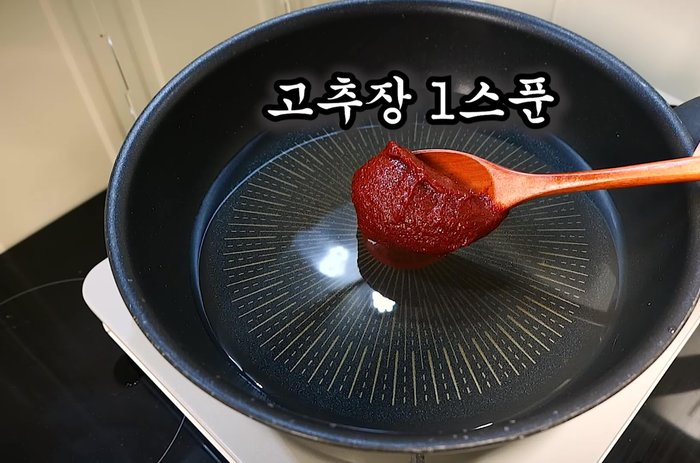 Add gochujang, soy sauce, red pepper powder, sugar, and chicken stock. Mix well to make the basic seasoning sauce.