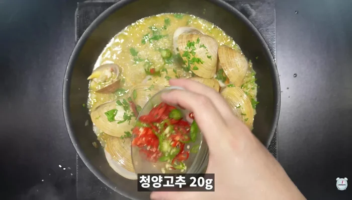 Add parsley and green chili peppers after 5 minutes.