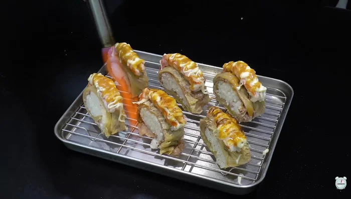 Lightly burn the mayonnaise with a torch.