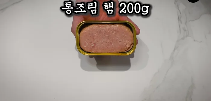 Prepare one can of ham, place it in a plastic bag, and knead until fully cooked.