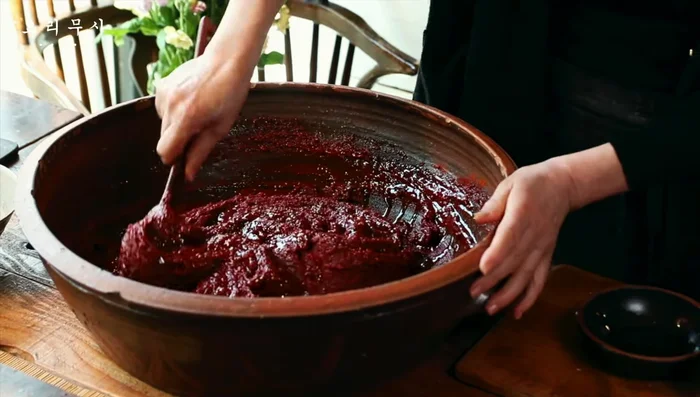 Add yellow plum syrup for savory flavor. Adjust consistency with more water, red pepper powder, or pear juice, as needed.