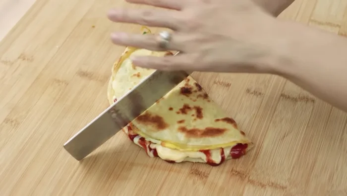 Fold the tortilla in half or quarters.