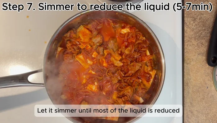 Return the onion and pork (if using) to the top of the tofu. Let simmer until most of the liquid is reduced (5-7 minutes).