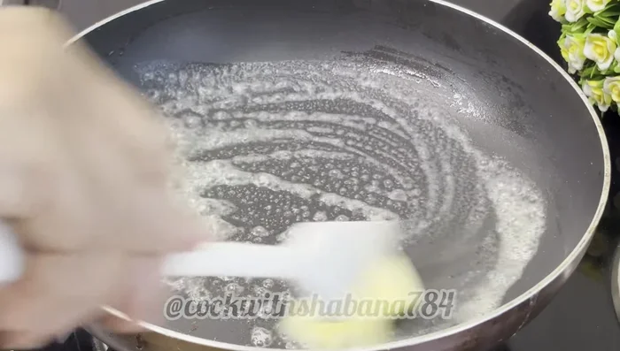 In the same pan, melt 1 tablespoon of butter. Add the vegetable-egg mixture and cook over low heat until set, forming a rectangular omelette (173.92).