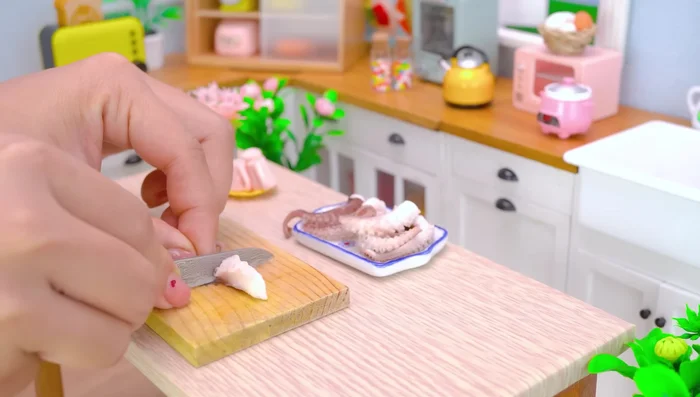 Prepare the baby octopus. Cut it into small pieces.