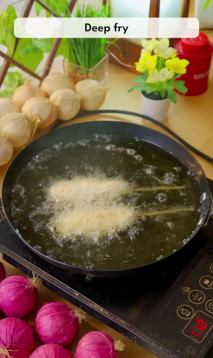 Fry the corn dogs: Deep fry the corn dogs in hot oil over high heat until golden brown. Be quick to prevent the cheese from melting out completely.