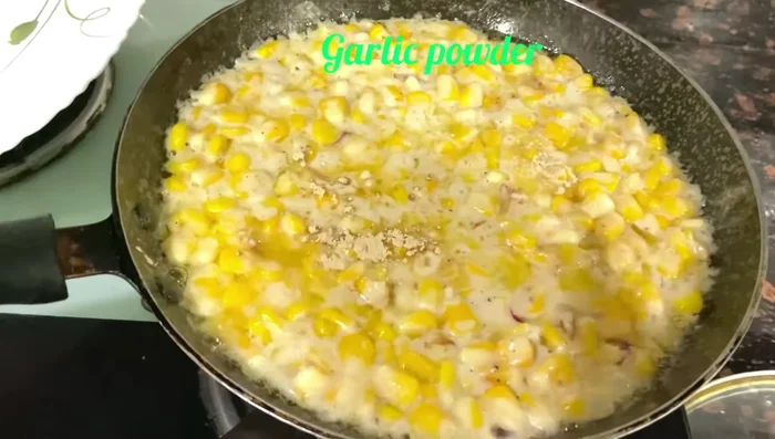 Remove from heat, stir in 1/2 teaspoon of garlic powder, and serve.