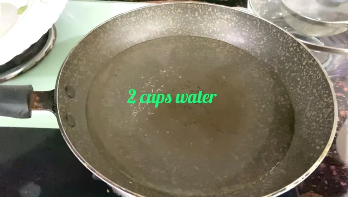 Boil 2 cups of water in a frying pan. Add 1/2 teaspoon of salt.