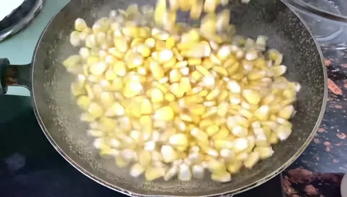 Add 4 cups of fresh corn to the boiling water. Cover and boil for 2 minutes, or until slightly cooked.