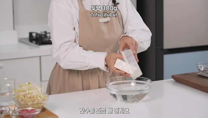 Soak the tofu in cold water to drain some of the brine. Change the water 1-3 times for a sweeter and less bitter taste. (Optional)