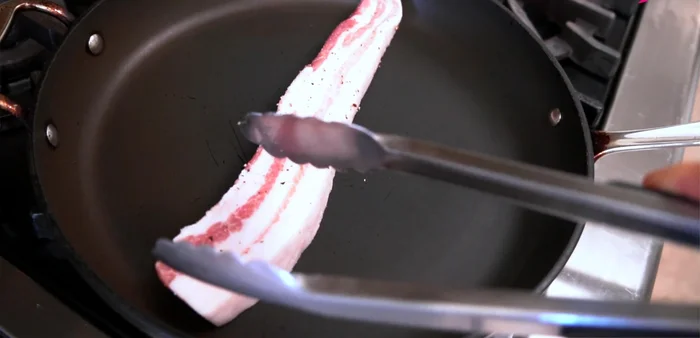 Pan-fry the pork belly: Preheat a frying pan over high heat. Add pork belly slices, leaving space between them. Cover loosely with foil and cook for 2-3 minutes per side, or until golden brown. Reduce heat to medium-high for the second side. (198.599)