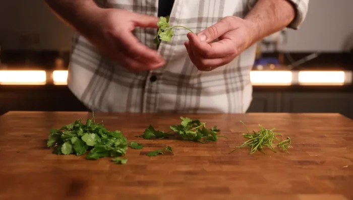 Add coriander stalks and toasted sesame seeds to the marinade. Mix well.