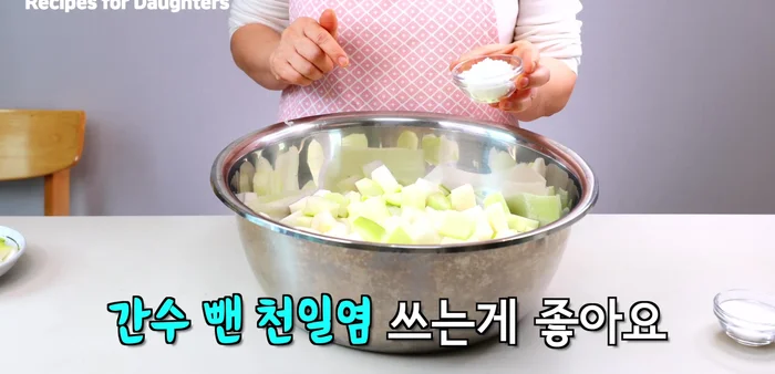 Mix the cubed radish with sea salt and white sugar. Let it sit for about an hour, turning it halfway through.