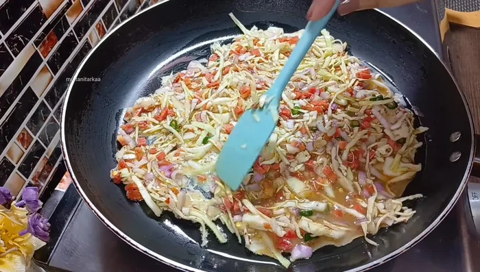 Cook on low heat, covered, for 2-3 minutes until the top is set.