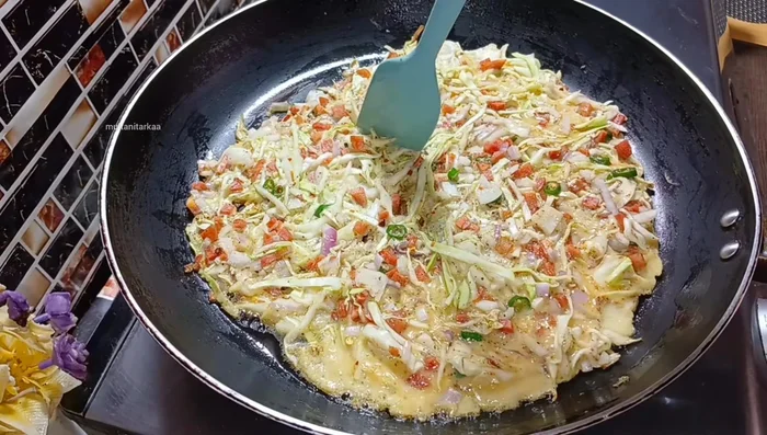 Cut the omelette into four pieces.