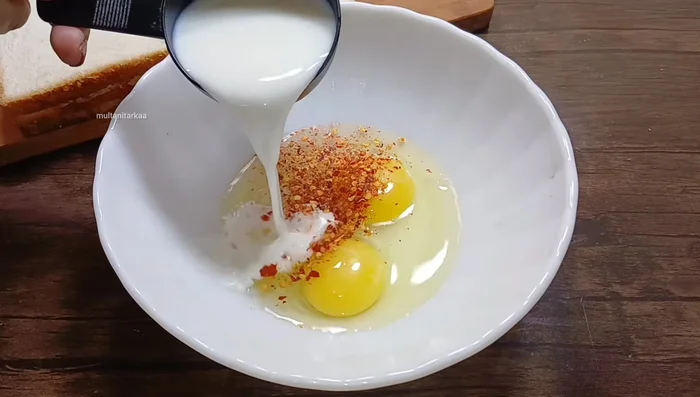 In a separate bowl, whisk together milk, remaining salt, and crushed red chili powder.