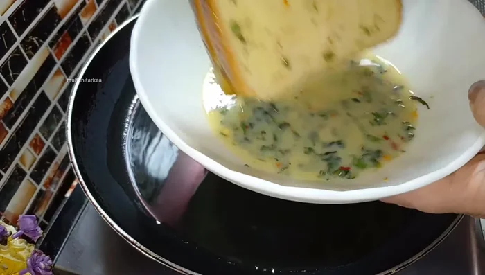 Dip each sandwich in the milk mixture and shallow fry in a pan with a little oil until golden brown and crispy.