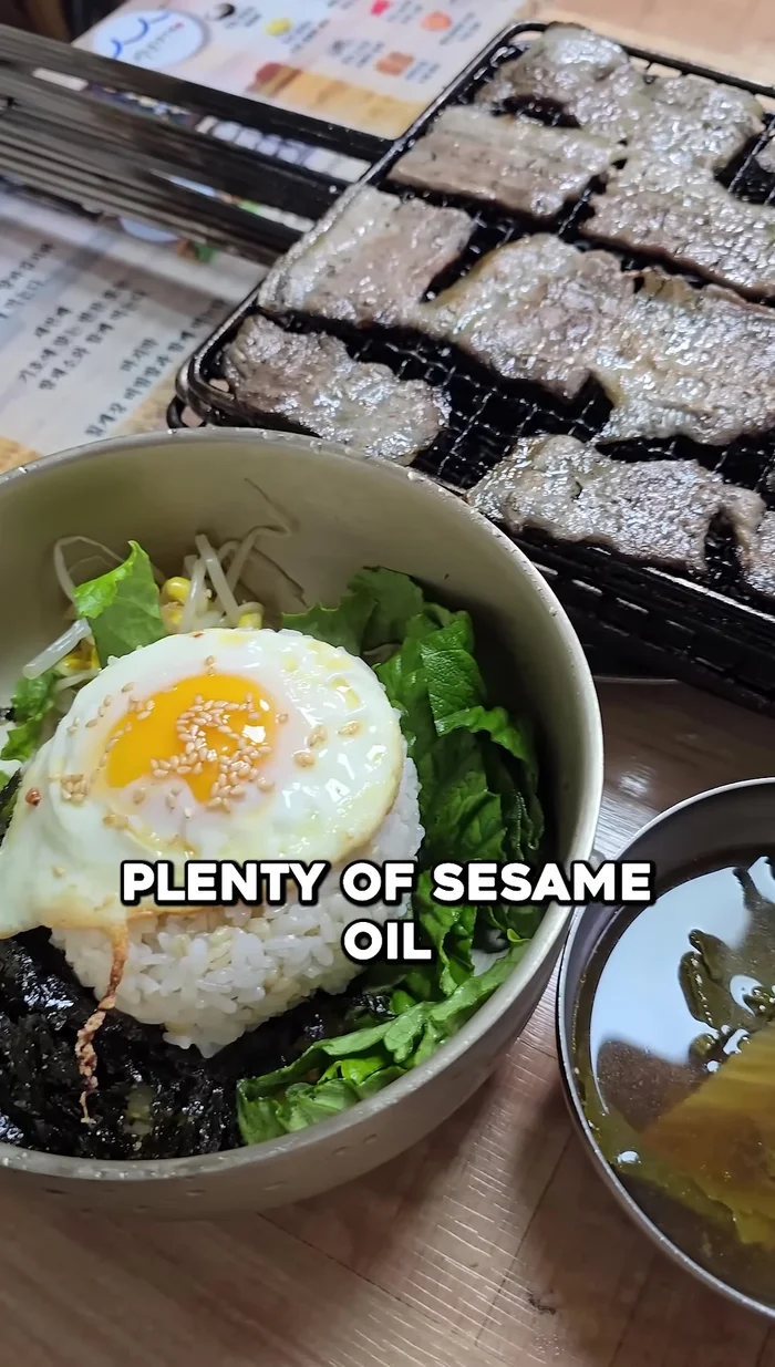 For the Bibimbap: Prepare rice, top with the perfectly fried egg, plenty of sesame oil, and instead of the red pepper paste use the crab chil Jang.