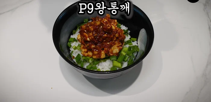 Assemble the rice bowl: Place hot white rice in a bowl. Sprinkle with chopped green onions, the prepared egg mixture, sesame oil, and sesame seeds.