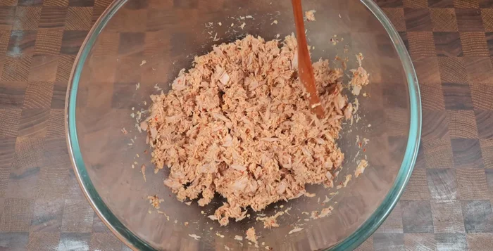Break the tuna into smaller pieces.