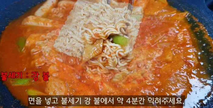 Add the ramen noodles and cook for about 4 minutes, stirring occasionally, until the broth thickens.