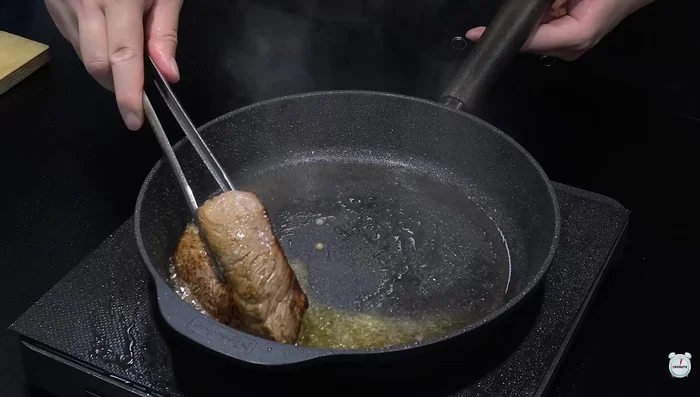 Fry the outside of the sirloin steak until golden brown.