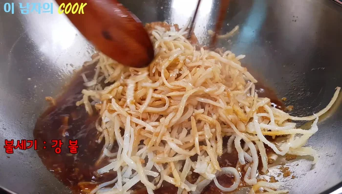 Mix well and simmer, flipping occasionally, until the seasoning has stopped flowing on the bottom of the wok or pan.
