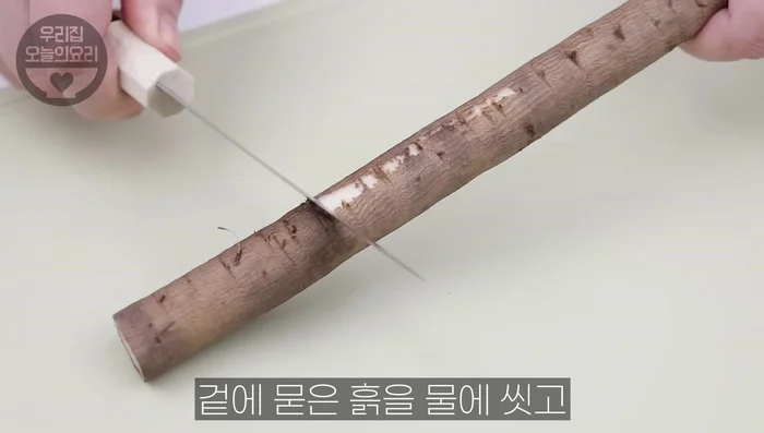 Prepare sesame burdock: Wash, peel, and cut burdock. Blanch in boiling water with vinegar. Prepare seasoning (sugar, mirin, vinegar, soy sauce, sesame seeds). Mix burdock with seasoning.