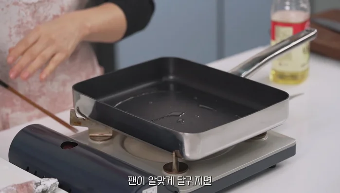 Heat cooking oil in a pan and fry the tofu, pork belly, and perilla leaf rolls on both sides until golden brown. Adjust heat to medium to prevent burning.