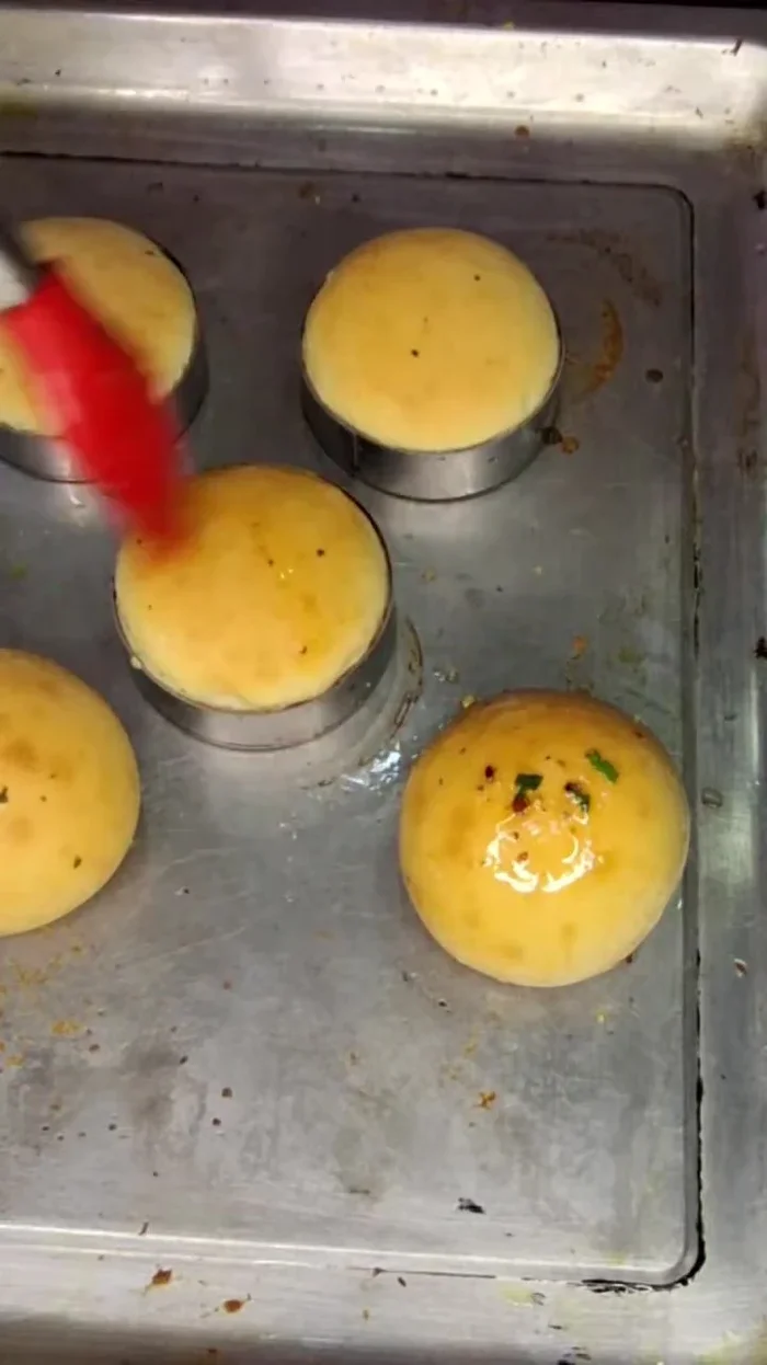 Using a small ring cutter, cut the buns into equal-sized pieces.