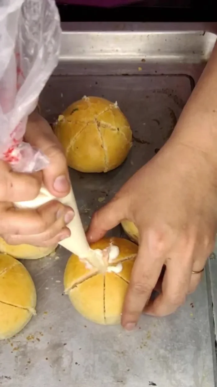 Fill the cut buns with the cream cheese mixture, adding cheese and/or other fillings (optional) as desired.