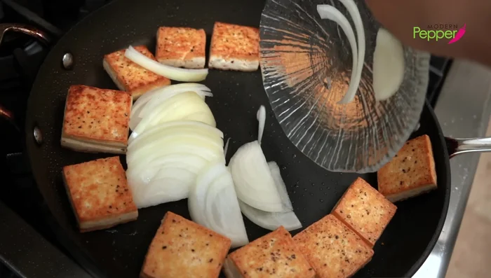 Braising: Push the tofu to the sides of the pan. Add the onions to the center, sprinkle with salt, and pour the soy sauce seasoning over everything. Reduce heat to medium, cover with foil and a lid, and simmer for 5 minutes.