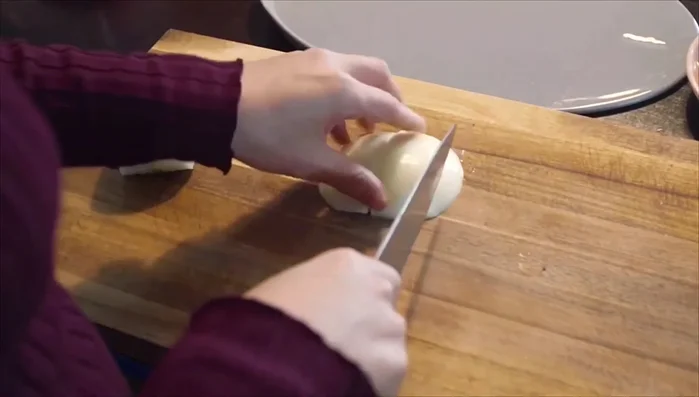 Dice half of the onion and slice the other half.