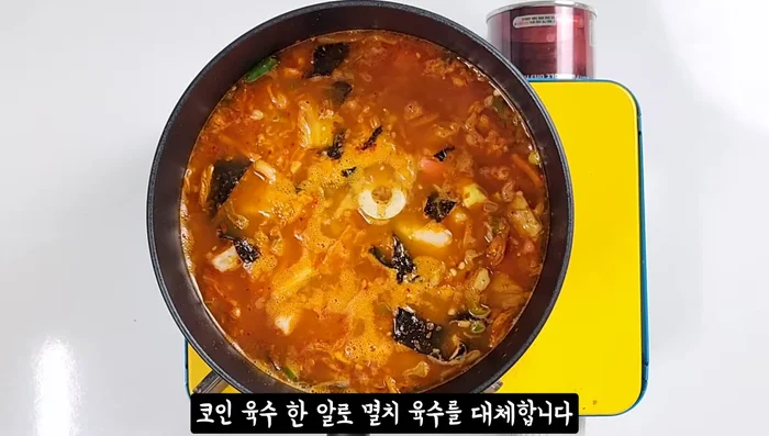 Replace anchovy broth with one coin broth, then add the reserved kimchi broth and beef dashi. Simmer until the broth thickens slightly.