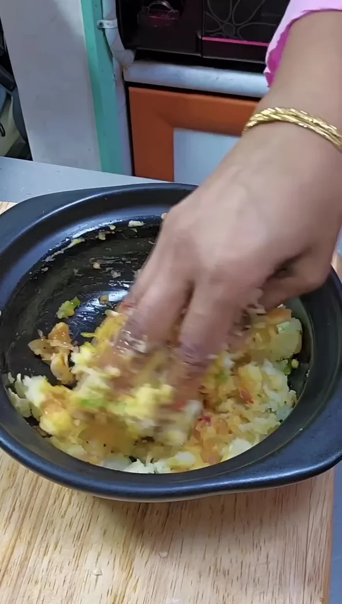 Thoroughly mash the potato filling, combining all ingredients until well mixed.