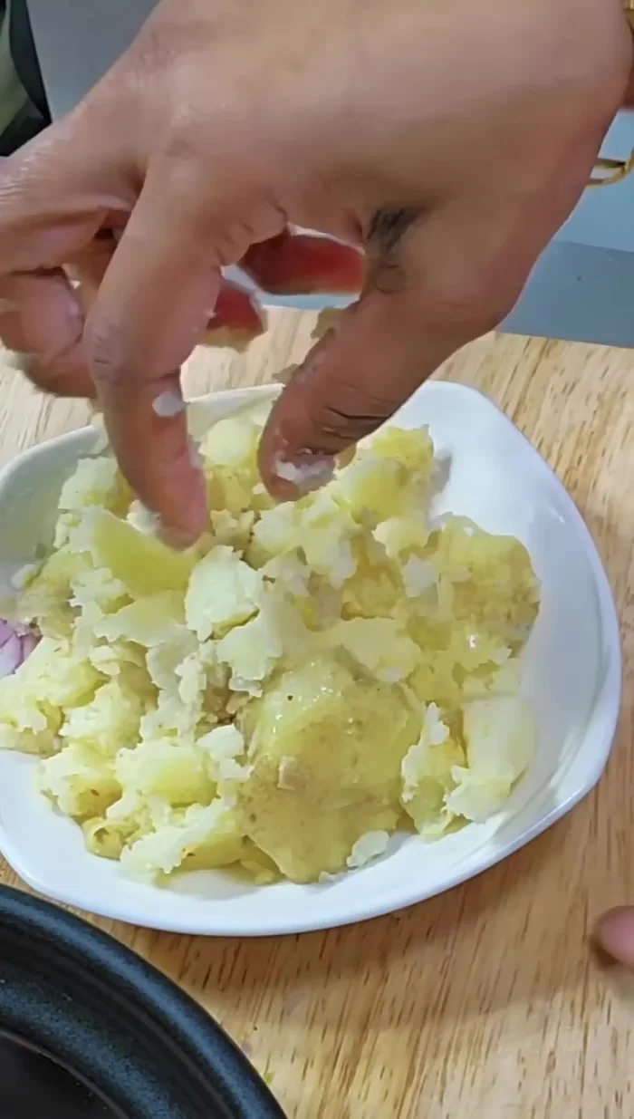 Mash the potatoes slightly.