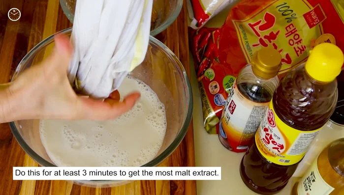 Squeeze out the liquid from the soaked barley malt mixture. Add another cup of water to the mixture and thoroughly mix again.