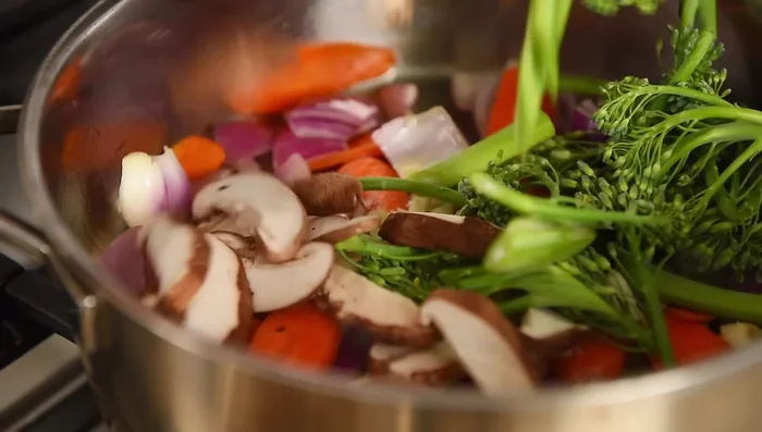Add garlic, shitake mushrooms, and broccolini; sauté for 3-4 minutes.