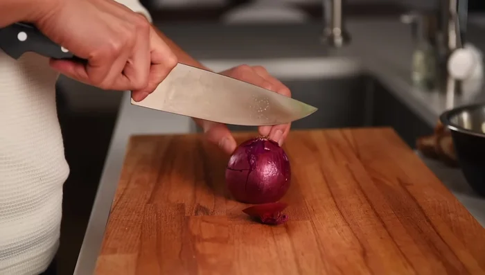 Peel and chop one red onion into bite-sized pieces. You can use shallots or white onion if preferred.