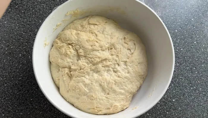First proof: Cover the dough and let it double in size for about an hour.