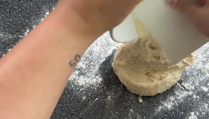 Form the pancakes: Take a portion of dough, place filling in the center, pinch and seal the edges to form a ball. (Practice makes perfect!)