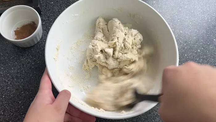 Combine wet and dry ingredients: Mix the activated yeast mixture with the flour.