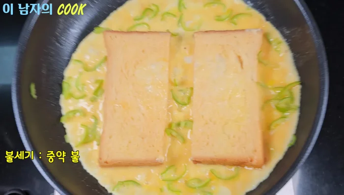 Once the bottom is cooked, flip it over and fold the egg inside the bread.