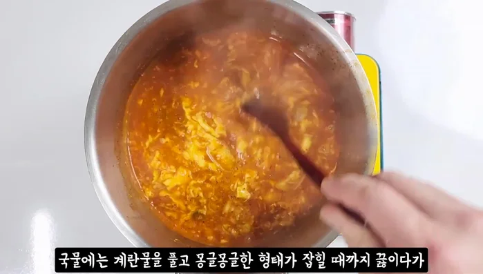 Pour the egg broth over the noodles.
